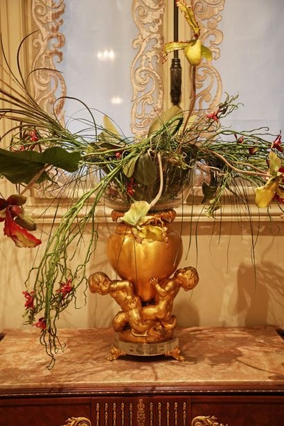 Gilded bronze vase decorated with three tritons,...