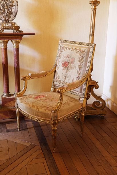 A carved and gilded wooden living room set...