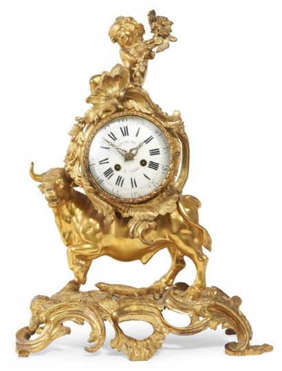 PENDULE en bronze doré, à cadran émaillé...
