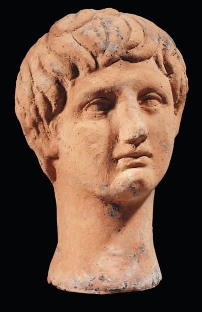 Tête votive représentant le visage d'un jeune...