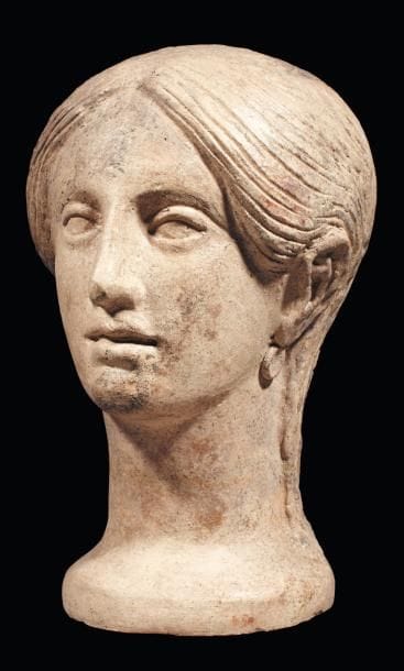Tête votive représentant le visage d'une...