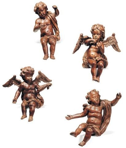 Suite de quatre angelots en bois sculpté,...