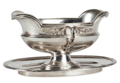 Saucière en argent de forme ovale, unie et...
