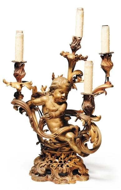 Candélabre en bronze doré à décor d'un putto,...