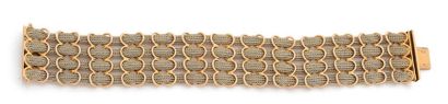 BRACELET en or 18K (750), articulé de 4 brins...