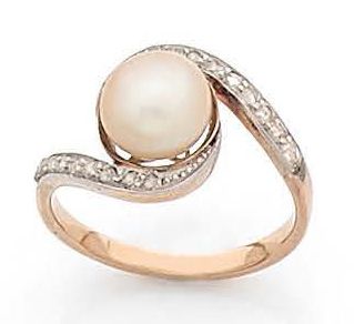 BAGUE croisée en or 18K (750), ornée d'une...