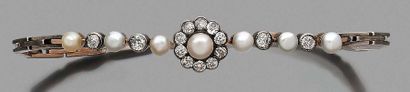 BRACELET en or 14K (585) et argent, orné...