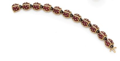 BRACELET articulé en or jaune 18K (750) formé...