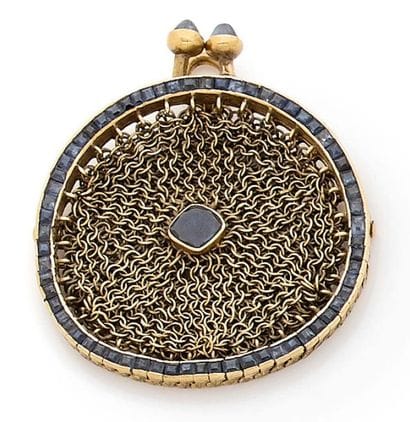 BOURSE montée en pendentif en or jaune 18K...
