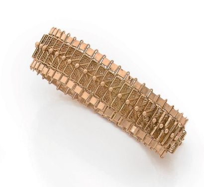 BRACELET SOUPLE en or jaune 18K (750) articulé...