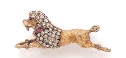 BROCHE en or jaune 18K (750), figurant un...