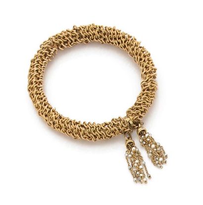 BRACELET JONC en or jaune 18K (750) entouré...