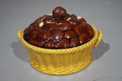 Earthenware terrine simulating a basket filled...