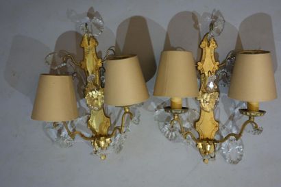 Pair of ormolu sconces and crystal pendants,...