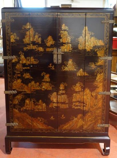 Lacquered wooden cabinet with landscape decoration....