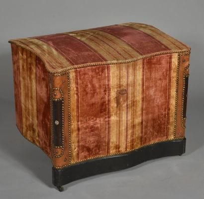 Wooden chest covered with fabric and studded...