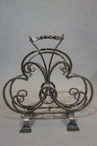 Wrought iron magazine rack with arabesque...