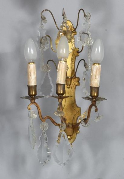 Pair of engraved, gilded brass sconces with...