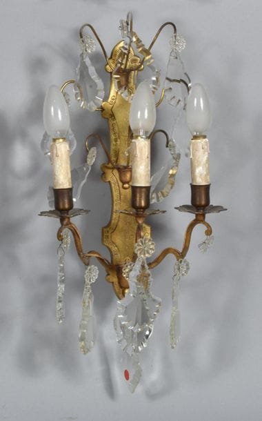 Pair of engraved, gilded brass sconces with...