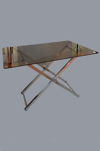 Desk with X-shaped metal base supporting...