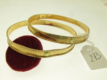 2 rigid bracelets in the same two-tone gold...