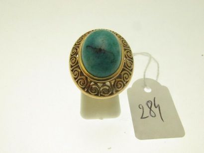 1 large gold ring with openwork scroll decoration...