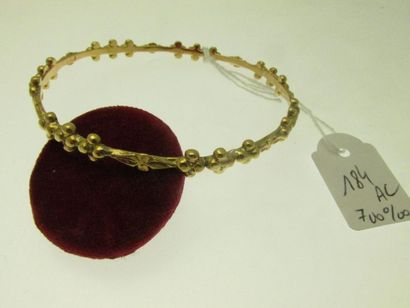 1 gold bangle 700°/°° with beaded and chiselled...