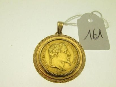 1 gold pendant set with a piece of 20Frs...