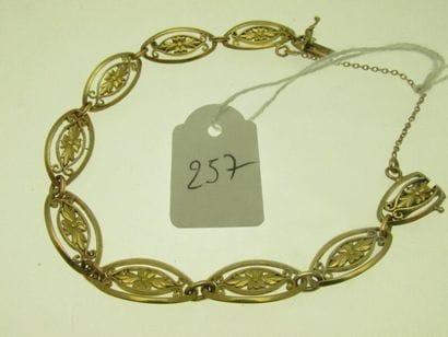 1 gold bracelet with filigree links and safety...