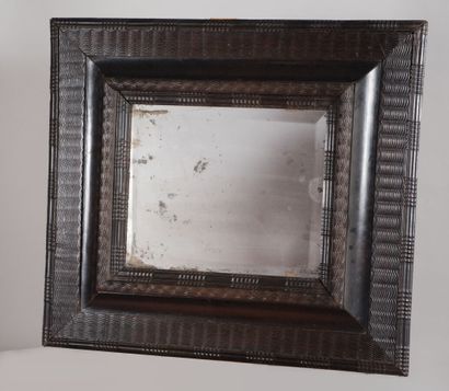 Miroir à profil inversé en bois noirci, à...