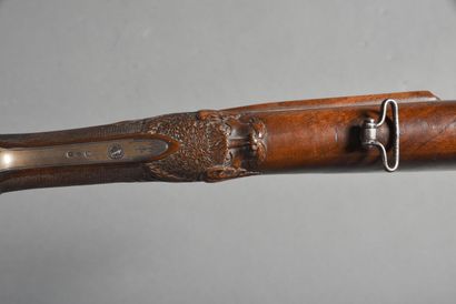 Side-action shotgun with 2 juxtaposed barrels...