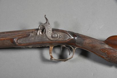 Side-action shotgun with 2 juxtaposed barrels...