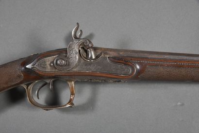 Side-action shotgun with 2 juxtaposed barrels...