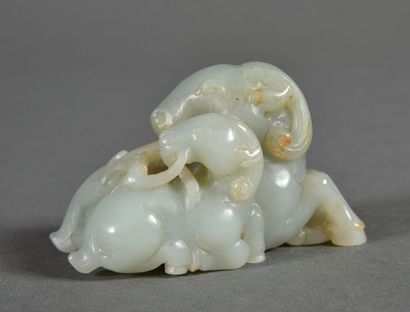 Two celadon jade groups, one depicting a...