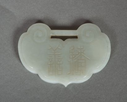 Pendant in light celadon jade, in the shape...