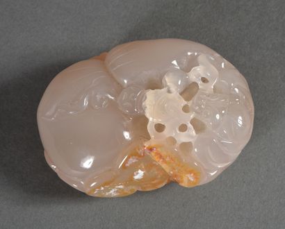Grey agate pebble with rust veins carved...