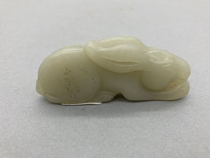 Two celadon jade pendants, one depicting...