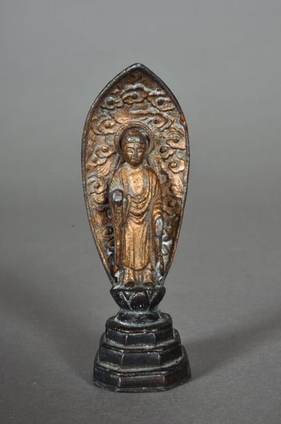 Small gilt bronze and black lacquered subject,...