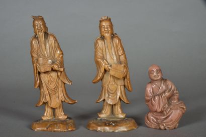 Three soapstone subjects, one of beige-pink...