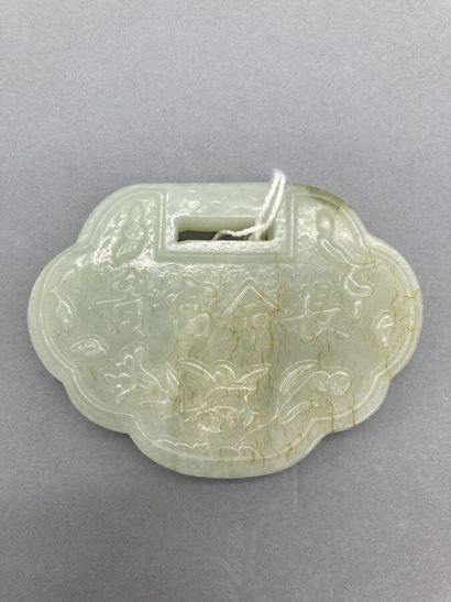 Two jade objects, one in white jadeite veined...