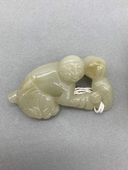 Two celadon jade subjects representing children,...