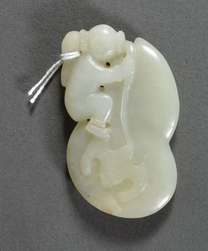 Two celadon jade pendants, one depicting...