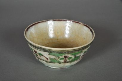Cream glazed ceramic bowl with brown stylized...