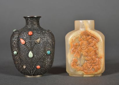 Two small snuffboxes, one in steatite decorated...