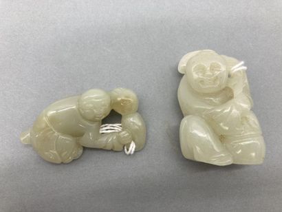 Two celadon jade subjects representing children,...