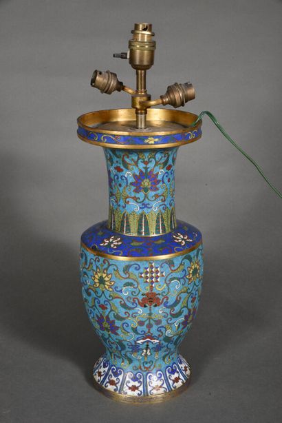 A long-necked baluster vase with a flared...