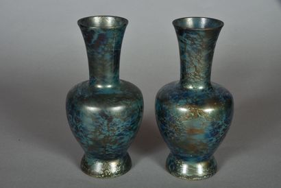 A pair of long-necked, wide-bodied vases...