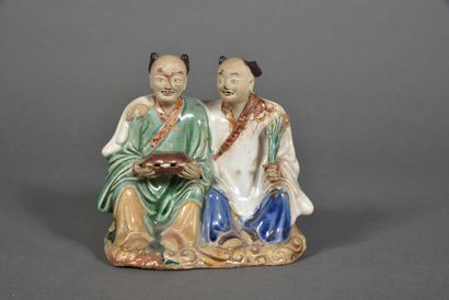 Polychrome glazed stoneware group representing...