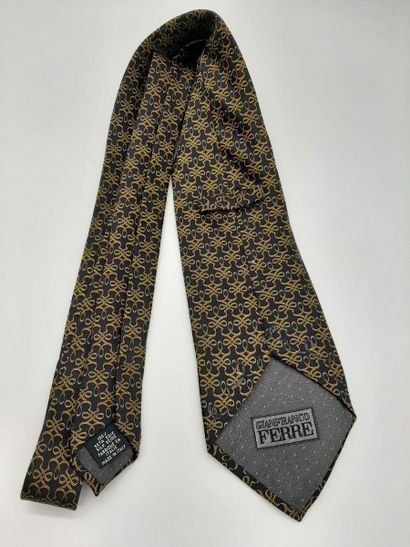 CHANEL. Blue silk tie with yellow polo mesh...
