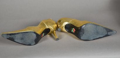 FREE LANCE. Pair of golden leather pumps...